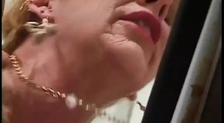 Younger guy gets blown by 70 year old redhead in kitchen