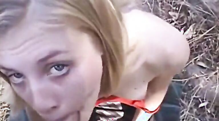 Young blonde amateur sucking a big cock outside