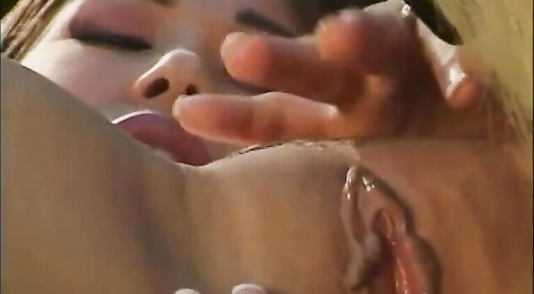 Busty Asian brunette rubs her clit while taking a dildo up her pussy